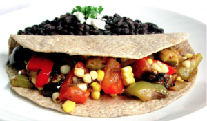 vegetable taco with side of beans