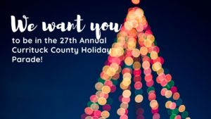 Call for parade participants with christmas tree made out of lights in background