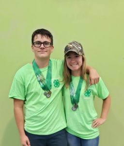 sharp shooters pose for picture with their medals