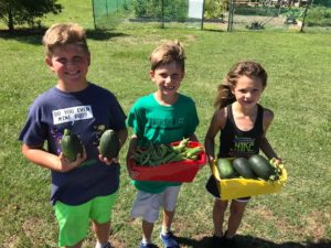 kids holding vegetables