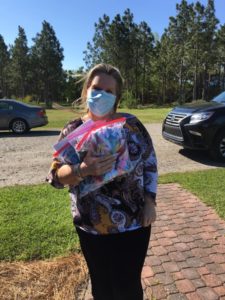 woman with bags of face coverings