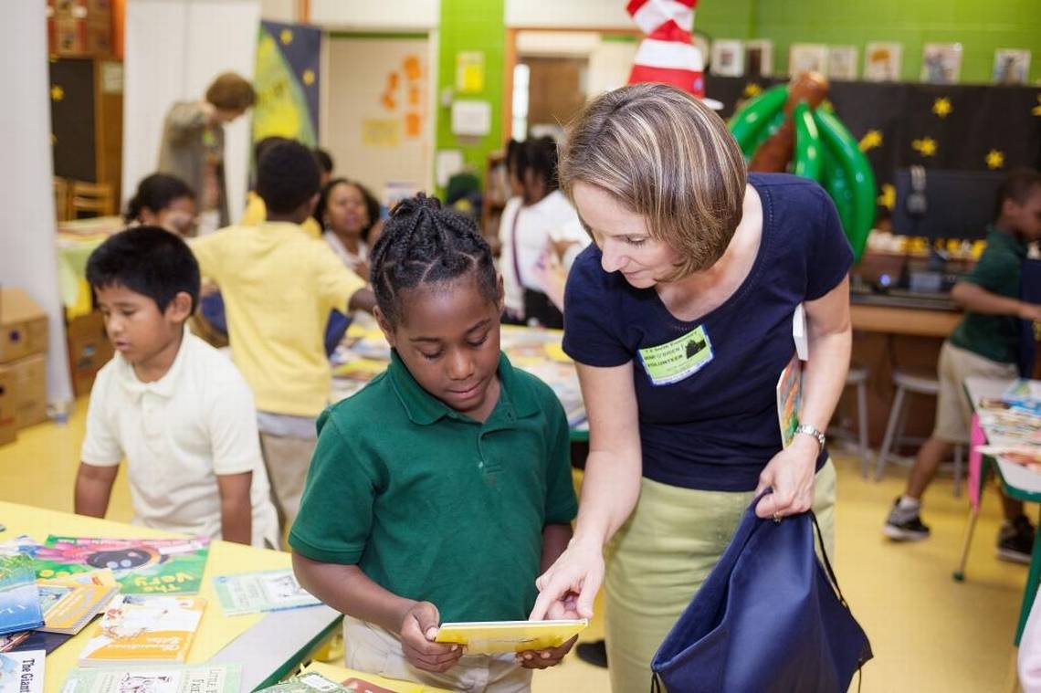 Teacher helping student