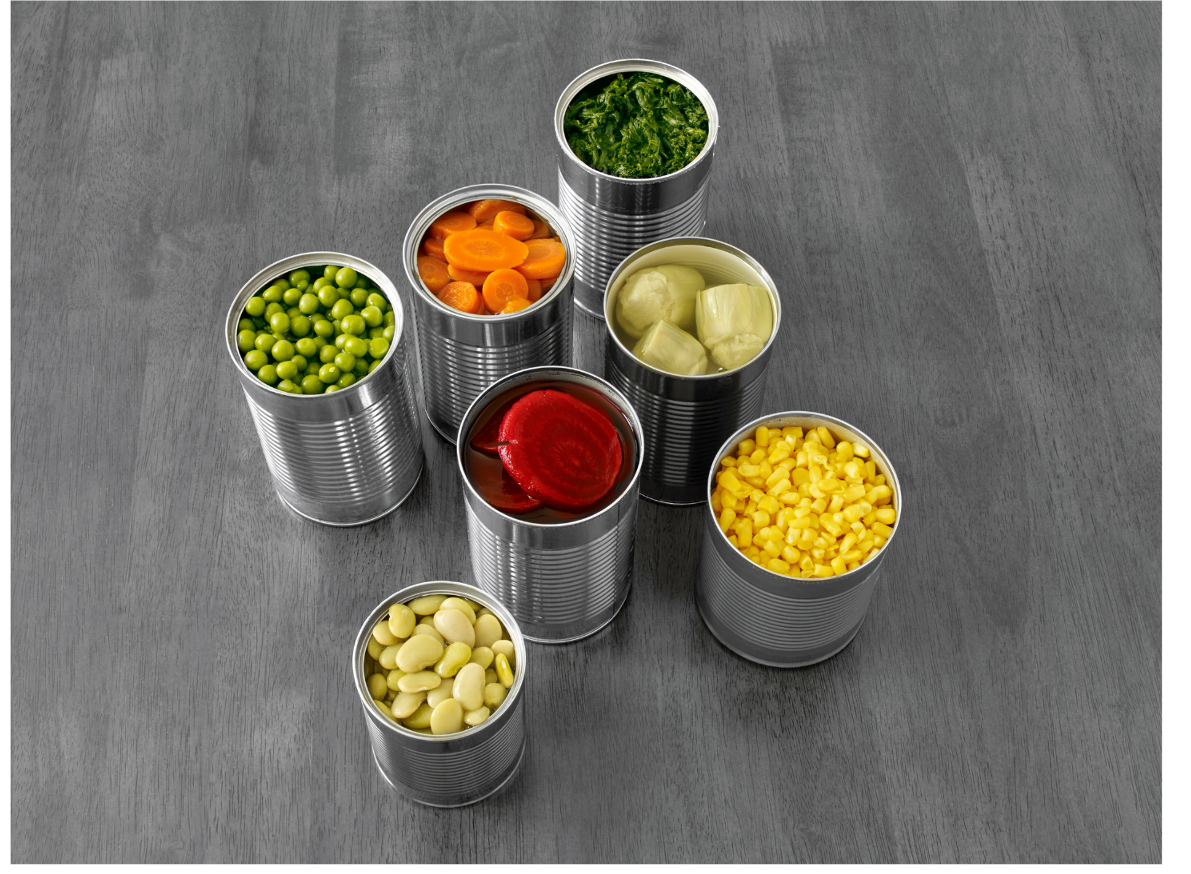 7 cans of canned vegetables with lids removed