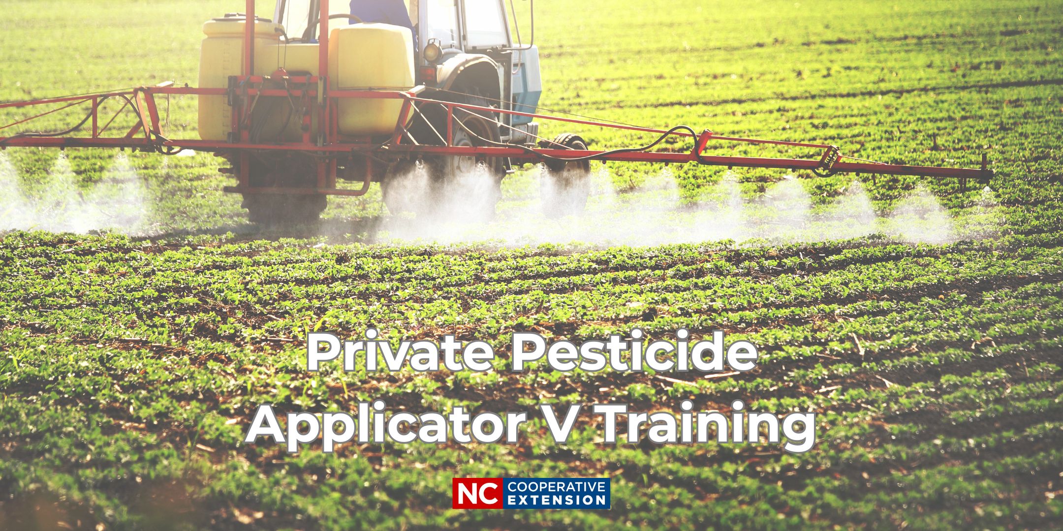Tractor spraying a field